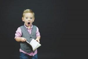 Boy preaching or singing?